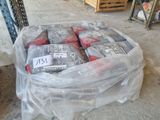 a plastic bag filled with assorted items on the ground