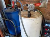 a picture of a water tank with a hose attached to it