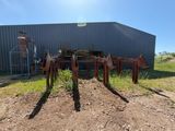 an image of a farm equipment stand in front of a building