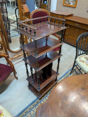 a table and chairs in a room with a mirror on the wall