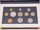 a picture of a picture of some coins in a box