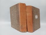 two books sitting on top of each other on a table