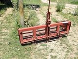 a red bench that is sitting in the grass