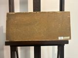 a wooden easel with a piece of paper on top of it