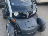 a small car that is parked in the parking lot