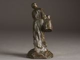 bronze statue of a woman holding a bucket and a dog