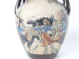 a large vase with a painting on the side of it