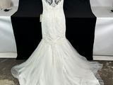 the back of a wedding dress on a mannequin mannequin stand