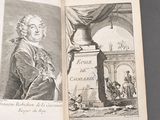 an open book with a picture of a man and a statue