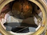 an image of a close up of a clock in a metal case