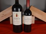 two bottles of wine sitting next to each other on a table