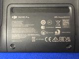 a close up of a laptop battery on a blue surface