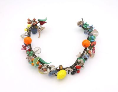 multicolored beaded bracelet with glass beads on a white background