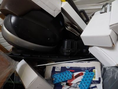 a pile of assorted electronics and electronics on the floor