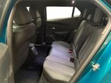 the back seat of a blue car with a seat belt in it