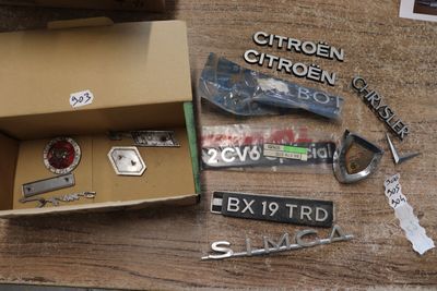 a box that has various items in it on a table