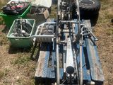 a lot of tools that are laying out in the grass