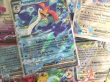 a lot of pokemon cards that are on the table