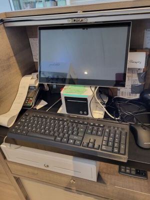 a desk with a keyboard, mouse, and monitor on it