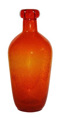 an orange glass vase that is sitting on a white surface