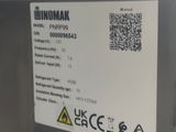 a label on the back of a machine that says binomak