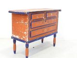 a small wooden table with a drawer on top of it