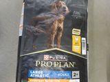 a bag of proplan dog food next to a bag of dog food