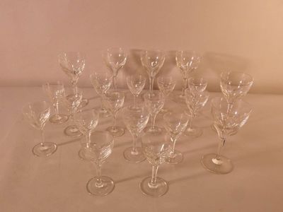 a lot of wine glasses sitting on a table