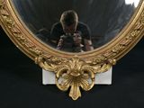 a man taking a picture of himself in a mirror
