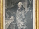 framed portrait of a man in a coat and a dog in a chair