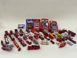 a lot of toy cars that are sitting on a table