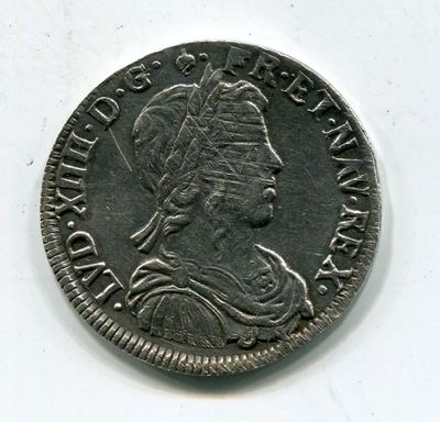 gros plan d'une pièce de monnaie sur laquelle figure une tête de femme