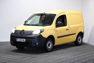the yellow van is parked in a white room with a checkered floor