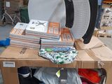 a stack of boxes with clothes on top of it