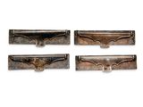 four pieces of metal are shown in a row on a white background