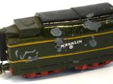 a toy train that is sitting on a white surface