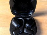 an image of a pair of black earphones sitting on a table
