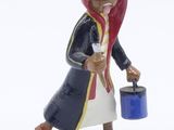 a figurine of a woman with a bucket of water
