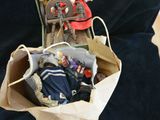 a doll sitting in a suitcase with a doll in it