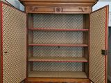 a cabinet that has a door open on the inside of it