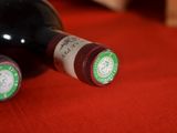 two bottles of wine that are sitting on a table