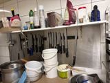 many pots and pans on the counter in the kitchen