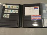 a black folder with stamps on it sitting on a table