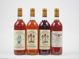 trois bouteilles de vin posées l'une à côté de l'autre sur une table