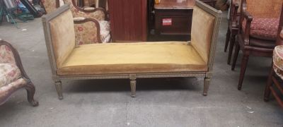 a couch that is sitting in the middle of a room