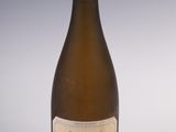 a bottle of wine that is sitting on a table