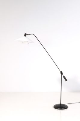 an image of a black and white floor lamp on a white surface