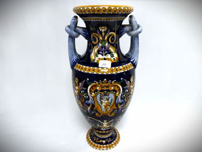 a blue vase with a gold and blue design on it