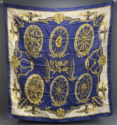 a blue and gold silk scarf with a picture of a clock on it