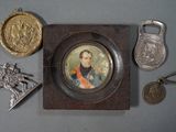 a picture of a picture of a man with a medal and other items